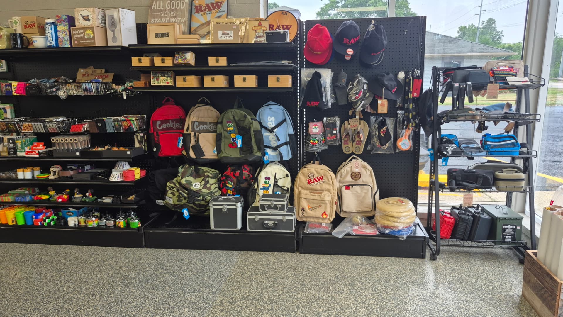 RAW and Cookies backpacks, hats and stash cases on display